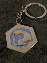 Load image into Gallery viewer, LIMITED: Eyes of Azure GLOW IN THE DARK hard enamel keychain
